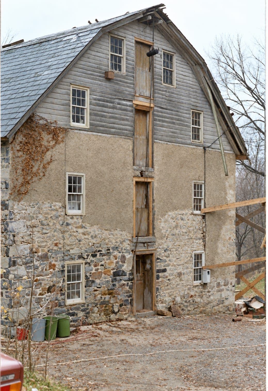 The same braced gambrel end, colour and detail recovered