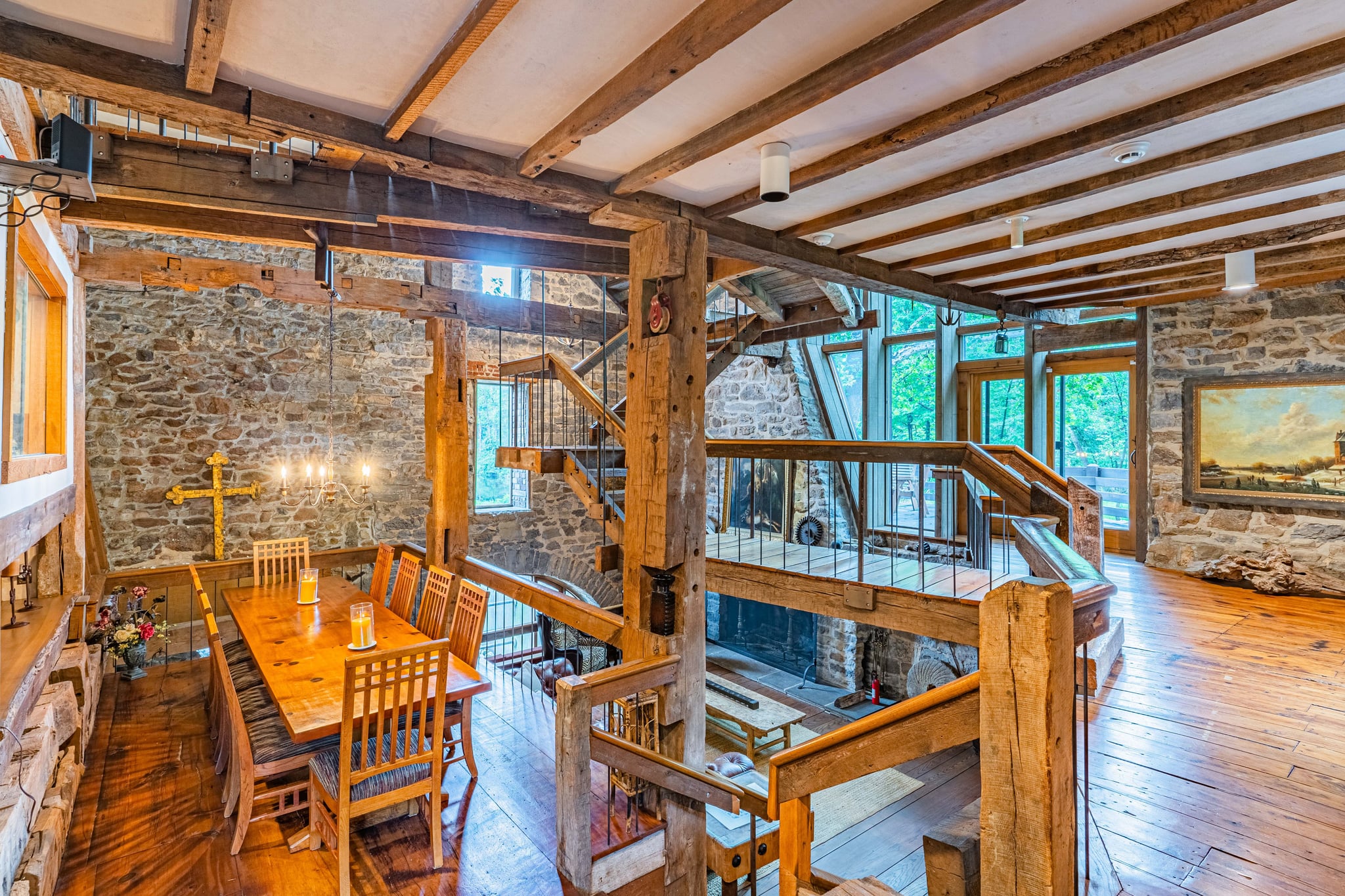 Sitting area with leather chairs, exposed beams, and vintage decor