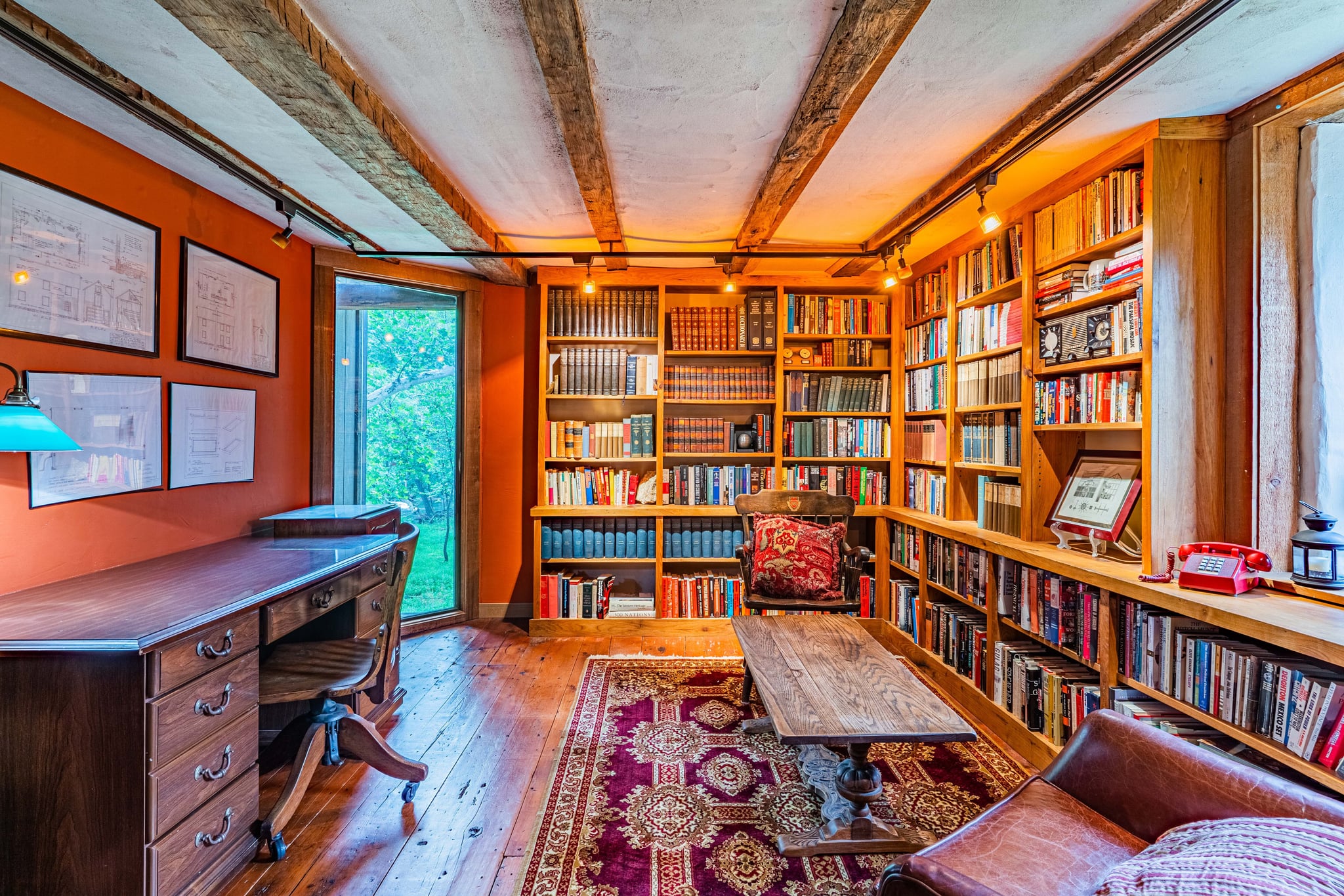 Vintage bar area with stone wall, wooden counter, and warm pendant lighting